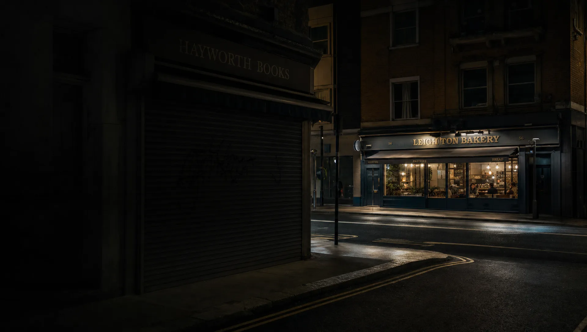 A dark high street at night with one closed shopfront fading into shadow while a brighter shop across the road catches the only pool of light, suggesting lost visibility and competitors taking attention.